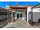 The backyard patio features a sliding glass door for indoor/outdoor living, with a rustic star adding character at 3120 N 67Th Ln # 31, Phoenix, AZ 85033