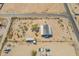 Aerial view of a metal roof home, various outbuildings, and desert landscaping on a large lot at 31555 N Royce Rd, San Tan Valley, AZ 85144