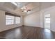 Bright bedroom with vaulted ceilings, wood floors, and large windows with neutral blinds at 31555 N Royce Rd, San Tan Valley, AZ 85144