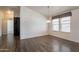 Dining area featuring wood floors and a large window providing natural light at 31555 N Royce Rd, San Tan Valley, AZ 85144