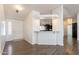 Bright entryway featuring a white front door and a half-wall to the kitchen area at 31555 N Royce Rd, San Tan Valley, AZ 85144