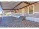 Charming home featuring a covered front entrance with stone steps and a unique, patterned concrete driveway at 31555 N Royce Rd, San Tan Valley, AZ 85144