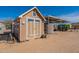 View of a shed with a covered area and water tanks, providing ample storage solutions at 31555 N Royce Rd, San Tan Valley, AZ 85144