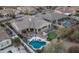 Aerial view of the home featuring a pool, putting green, outdoor kitchen, and lush landscaping at 31709 N 16Th Ave, Phoenix, AZ 85085