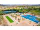 An aerial shot showcasing community park with tennis courts, a basketball court, and a bocce ball area at 31709 N 16Th Ave, Phoenix, AZ 85085