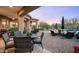 Inviting outdoor living space with dining, seating, BBQ and lush desert landscaping at 31709 N 16Th Ave, Phoenix, AZ 85085