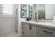 This bathroom vanity features a large mirror, framed prints and a shower at 31709 N 16Th Ave, Phoenix, AZ 85085