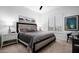 This modern bedroom features a comfortable bed, two nightstands with lamps, and stylish decor at 31709 N 16Th Ave, Phoenix, AZ 85085