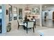 Elegant dining area with chandelier lighting and built-in cabinets to show off decor at 31709 N 16Th Ave, Phoenix, AZ 85085