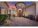 Charming courtyard entrance with brick pavers, stone accents, and a water feature fountain at 31709 N 16Th Ave, Phoenix, AZ 85085