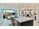 Open kitchen view with large island, stainless sink, and view of living room at 31709 N 16Th Ave, Phoenix, AZ 85085