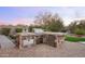 Outdoor kitchen featuring stainless steel grill, storage, and countertop space perfect for entertaining at 31709 N 16Th Ave, Phoenix, AZ 85085