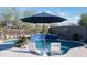 Inviting backyard pool featuring a water feature, desert landscaping, and stylish patio furniture for relaxation at 31709 N 16Th Ave, Phoenix, AZ 85085