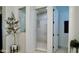 Bright shower with a white tile surround, glass door, and modern fixtures at 31709 N 16Th Ave, Phoenix, AZ 85085