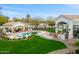 Resort-style backyard with pool, outdoor kitchen, built-in grill, and covered patios, perfect for entertaining at 3246 E San Miguel Pl, Paradise Valley, AZ 85253