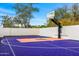 Custom basketball court featuring unique design elements and a well-maintained playing surface at 3246 E San Miguel Pl, Paradise Valley, AZ 85253