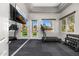 Bright exercise room with modern equipment, a mirrored wall, and backyard views through the sliding glass doors at 3246 E San Miguel Pl, Paradise Valley, AZ 85253