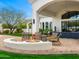 Backyard patio with a fire pit for gatherings, beautiful landscaping, and cozy seating at 3246 E San Miguel Pl, Paradise Valley, AZ 85253