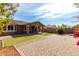 This backyard is landscaped and features a large stone patio area at 3254 N Park St, Buckeye, AZ 85396