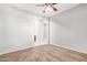 This bedroom features a ceiling fan, carpet, and doorway access to another part of the house at 3254 N Park St, Buckeye, AZ 85396