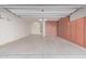 Spacious garage with overhead lighting, storage cabinets, and a water heater at 3254 N Park St, Buckeye, AZ 85396