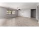 Bright and airy living room featuring neutral paint, tile floors, and a ceiling fan at 3254 N Park St, Buckeye, AZ 85396