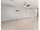 Large living room with tile floors and recessed lighting at 3254 N Park St, Buckeye, AZ 85396