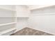 Carpeted walk-in closet featuring a closet rod and shelving for organization at 3254 N Park St, Buckeye, AZ 85396