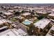 Aerial view of community featuring a sparkling pool, green spaces, and convenient parking at 3601 W Tierra Buena Ln # 233, Phoenix, AZ 85053