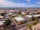 A picturesque aerial view of the community, highlighting its lush landscaping, sparkling pool, and well-maintained buildings at 3601 W Tierra Buena Ln # 233, Phoenix, AZ 85053