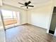 Bright bedroom with ceiling fan and sliding door to a balcony at 3601 W Tierra Buena Ln # 233, Phoenix, AZ 85053