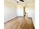 A bright bedroom with wood-look floors and ceiling fan provides comfortable living at 3601 W Tierra Buena Ln # 233, Phoenix, AZ 85053