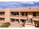 Close-up of a well-maintained apartment building, featuring clean lines, balconies and easy access with exterior stairs at 3601 W Tierra Buena Ln # 233, Phoenix, AZ 85053