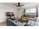 Cozy living room showcasing a comfortable seating arrangement, sleek flooring, and a view of the entryway at 3601 W Tierra Buena Ln # 233, Phoenix, AZ 85053