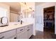 Bright bathroom featuring modern vanity, lighting, mirrors and walk-in closet at 3840 E Yeager Dr, Gilbert, AZ 85295