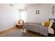 This bedroom features a cozy chair, natural light, and minimalist decor at 3840 E Yeager Dr, Gilbert, AZ 85295