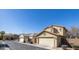 Charming home exterior featuring a two-car garage, well-manicured landscaping, and a neutral color scheme at 3840 E Yeager Dr, Gilbert, AZ 85295