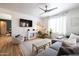 Bright living room with shiplap accent wall, modern furnishings, and lots of natural light at 3840 E Yeager Dr, Gilbert, AZ 85295