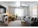 Bright living room with shiplap accent wall, modern furnishings, and lots of natural light at 3840 E Yeager Dr, Gilbert, AZ 85295