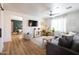 Bright living room with shiplap accent wall, modern furnishings, and lots of natural light at 3840 E Yeager Dr, Gilbert, AZ 85295