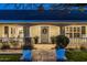 Inviting front entrance featuring a gray front door with a wreath, stone pathway, and beautiful planters at 4111 N 52Nd St, Phoenix, AZ 85018