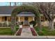 Beautiful front entrance with a lush, floral-covered archway leading to the welcoming front door at 4111 N 52Nd St, Phoenix, AZ 85018