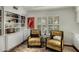 Comfortable sitting area with built-in bookcase and stylish armchairs near shuttered windows at 4111 N 52Nd St, Phoenix, AZ 85018