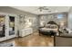 Spacious main bedroom featuring a brick accent wall, ceiling fan, and private outdoor access at 4111 N 52Nd St, Phoenix, AZ 85018