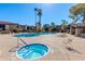 Community amenities with large swimming pool, hot tub, and lounge chairs at 4201 E Camelback Rd # 34, Phoenix, AZ 85018