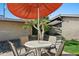 Charming backyard dining area featuring an orange tree and shaded patio at 4203 N 36Th St # 23, Phoenix, AZ 85018