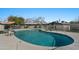 Sparkling community pool with lounge chairs and mature landscaping at 4203 N 36Th St # 23, Phoenix, AZ 85018