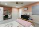 Cozy bedroom featuring a desk, shelving and two-tone paint, providing a comfortable retreat at 4208 E Sells Dr, Phoenix, AZ 85018