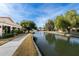 Scenic view of a waterfront community with lush landscaping and tranquil water features at 421 Leisure World --, Mesa, AZ 85206