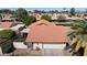 Aerial view of a well-maintained home with a vibrant red tile roof and two car garage at 421 Leisure World --, Mesa, AZ 85206